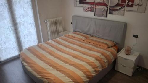 Postel nebo postele na pokoji v ubytování GS Valtellina