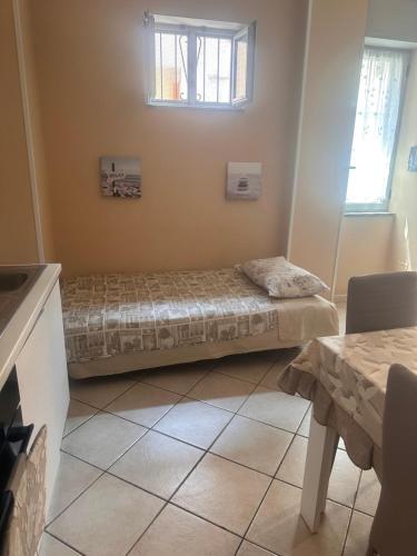 Postel nebo postele na pokoji v ubytování Annette Home Scafati-Pompei