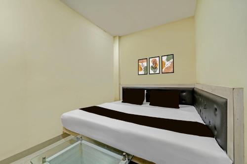 Ένα ή περισσότερα κρεβάτια σε δωμάτιο στο Hotel O Sanjay