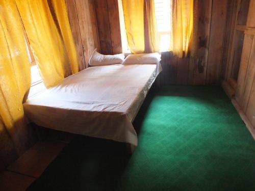 Postel nebo postele na pokoji v ubytování Paldor Peak Guest House