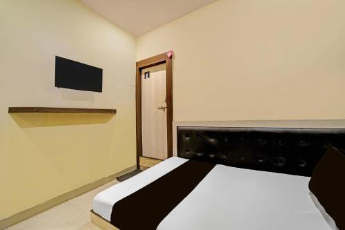 Ένα ή περισσότερα κρεβάτια σε δωμάτιο στο Hotel O Sanjay