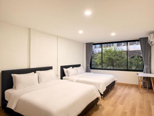 Postel nebo postele na pokoji v ubytování Serenova Hotel Siam Paragon, Bangkok