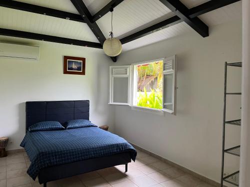 En eller flere senge i et værelse på VILLA ZEN