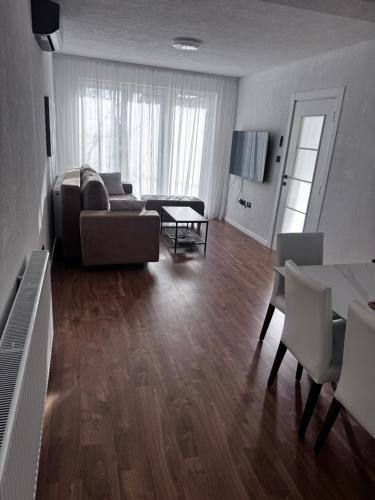 a living room with a couch and a table at Sarajevo Soul in Sarajevo