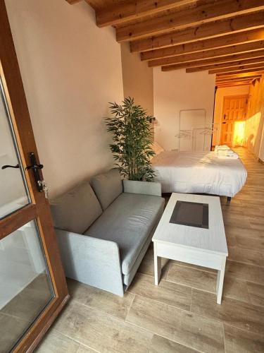 a living room with a couch and a table at La Herrería de Somo 1 in Somo