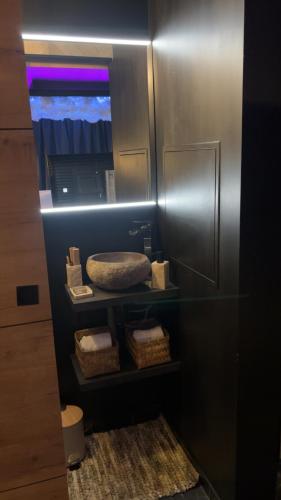 a metal locker with baskets and a mirror at Ecrin secret in Aubagne