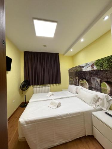 Postel nebo postele na pokoji v ubytování The Way Hotel Molinaseca