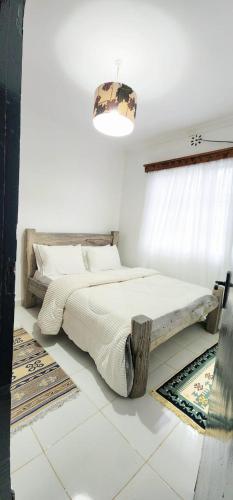 Ένα ή περισσότερα κρεβάτια σε δωμάτιο στο mount heaven get away