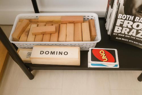 a box of dominoes on a shelf in a store at Tala Haven at Azure North Studio with Mt Arayat View in San Fernando