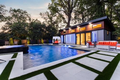 a swimming pool in the backyard of a house at The Raven A Luxury Guest House in Charlotte