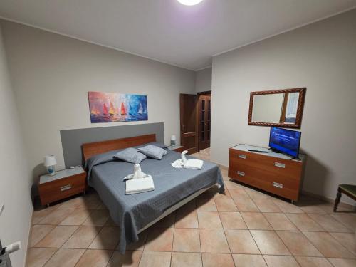 Ένα ή περισσότερα κρεβάτια σε δωμάτιο στο San Pietro Rooms