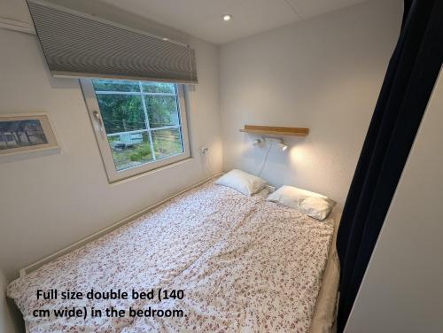 Postel nebo postele na pokoji v ubytování Tiny house 200 m from Kämpinge beach