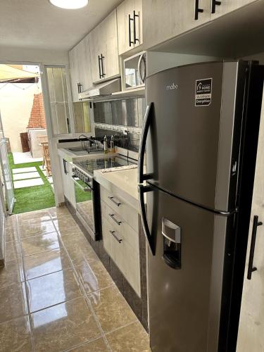 Kuchyň nebo kuchyňský kout v ubytování Privada cerca de playa con Jacuzzi, BBQ y Terraza