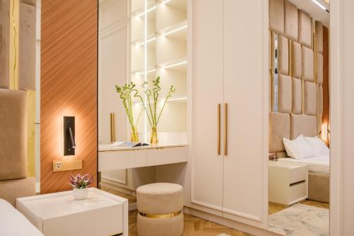 a room with a bedroom with a bed and a closet at Nest One Luxe, Элитные апартаменты с террасой и панорамным видом 067 in Tashkent