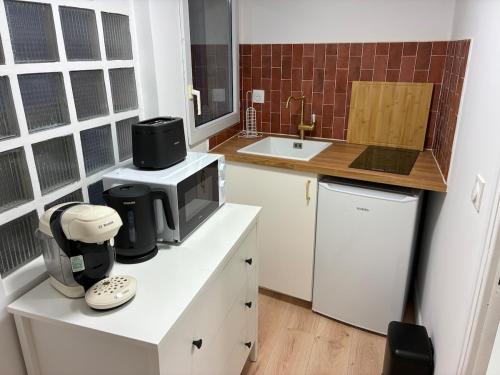 A cozinha ou kitchenette de Studio Cozy avec terrasse idéalement situé