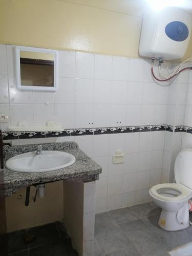 a bathroom with a sink and a toilet at Dar Sofiane in Sidi Bouzid