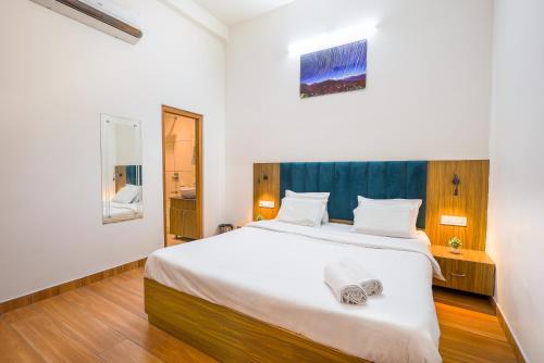 Postel nebo postele na pokoji v ubytování Palm Tree Villa