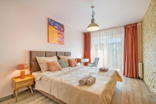 Ένα ή περισσότερα κρεβάτια σε δωμάτιο στο Jantar Porta Mare apartament