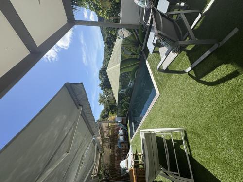 an overhead view of a building with a window and grass at Fully-equipped house with pool in Grande Saline