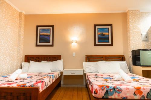 Ένα ή περισσότερα κρεβάτια σε δωμάτιο στο The Pilgrims' Place