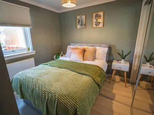 Ένα ή περισσότερα κρεβάτια σε δωμάτιο στο Central cosy stay - barrowlands and Glasgow green