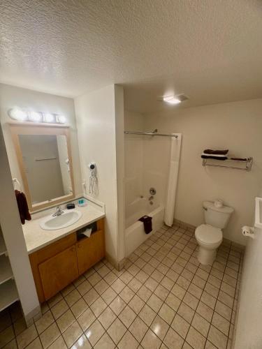 a bathroom with a sink and a toilet at Ocean Breeze Motel in Florence