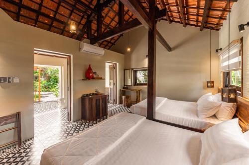 a bedroom with two beds in a room at Sun Village Beach Resort in Tuy Hoa