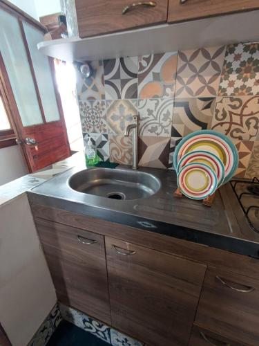 a kitchen with a sink and a counter top at cozy studio in Máncora