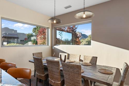 a dining room with a wooden table and chairs at 3BD-2BA Heated Pool & Spa Fire-pit BBQ Billiards in Sedona