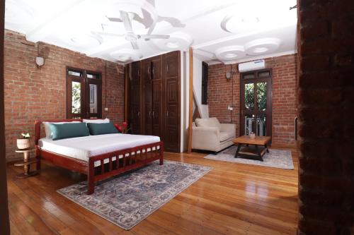 Postel nebo postele na pokoji v ubytování Brickhaus Hotel - Mbezi Beach