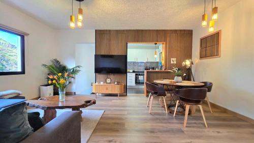 a living room with a couch and a table at The North Paradise - Porto Moniz in Porto Moniz