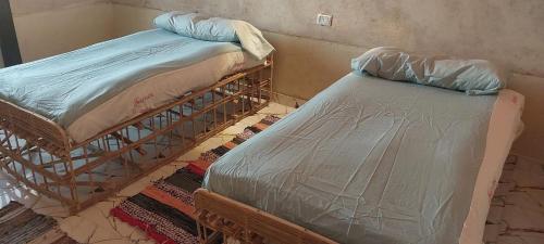 Ένα ή περισσότερα κρεβάτια σε δωμάτιο στο Nile Domes Guest House