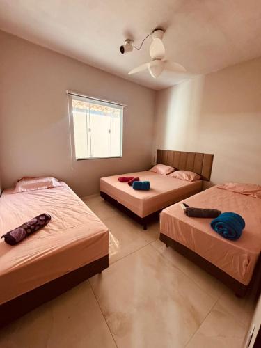 Postel nebo postele na pokoji v ubytování Casa de Praia Unamar