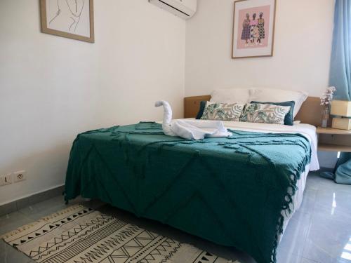 Postel nebo postele na pokoji v ubytování Évasion Turquoise, T2 bungalow plage privée