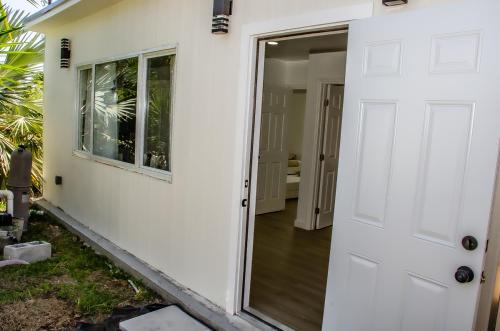 a door leading into a house with a porch at Comfy and Relaxed in Cutler Bay