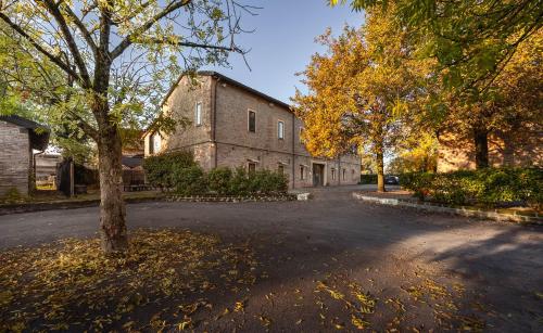 an empty street in front of a brick building at Villa D&D in Parma
