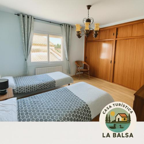 Ένα ή περισσότερα κρεβάτια σε δωμάτιο στο La Balsa