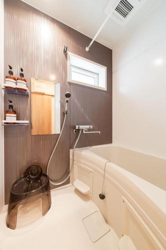 a bathroom with a shower and a toilet at M3Corner1 1-3F Detached house M3C1 in Musashino