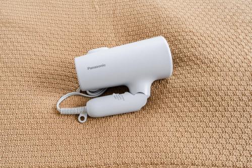a white hair dryer sitting on top of a couch at M3Corner1 1-3F Detached house M3C1 in Musashino