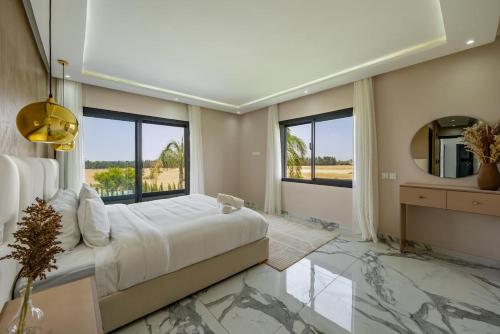 Ένα ή περισσότερα κρεβάτια σε δωμάτιο στο Appartement de rêve à Taghazout Vue mer exceptionnelle