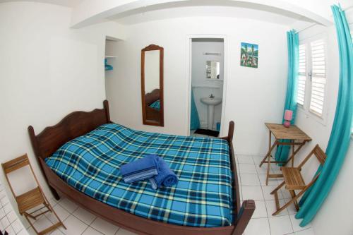 Postel nebo postele na pokoji v ubytování Villa bougainvillier