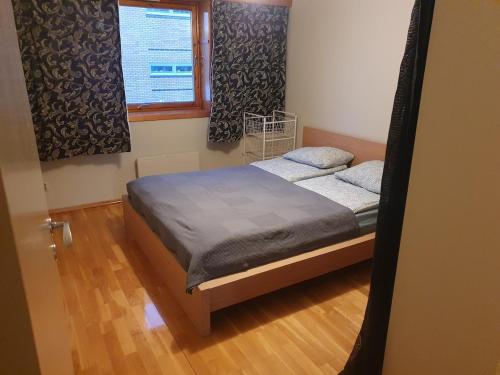 Ένα ή περισσότερα κρεβάτια σε δωμάτιο στο Trosterud i Oslo