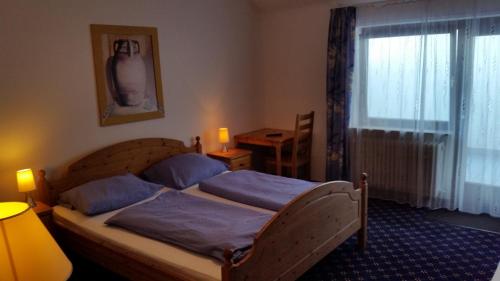 Ένα ή περισσότερα κρεβάτια σε δωμάτιο στο Hotel Elsenztal