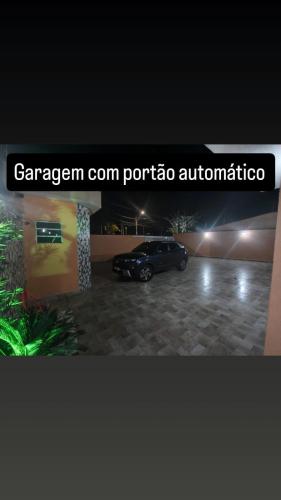 a car parked in a parking lot at night at Casa de condomínio com piscina e churrasqueira in Sao Paulo