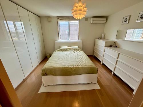 Postel nebo postele na pokoji v ubytování Nasu Townhouse S-2