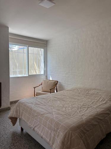 Giường trong phòng chung tại Asoma Madryn