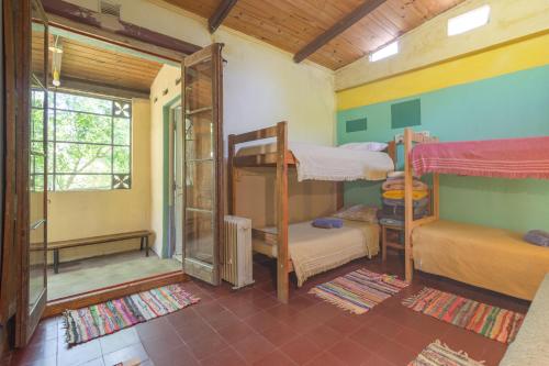 Ένα ή περισσότερα κρεβάτια σε δωμάτιο στο Casa del arbol hostel