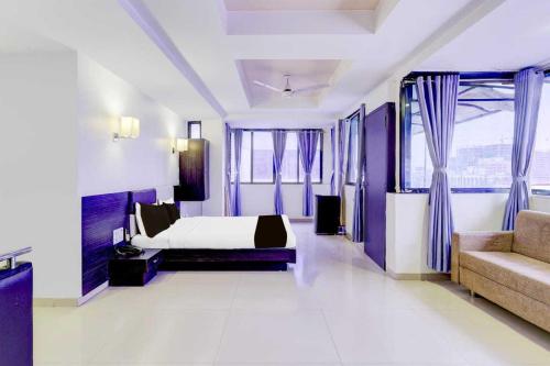 Ένα ή περισσότερα κρεβάτια σε δωμάτιο στο Collection O Infocity Metro Station Gandhinagar