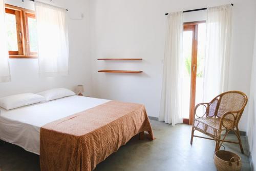 En eller flere senge i et værelse på Athmaya Villa, Ahangama
