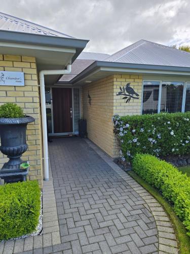 a house with a brick driveway in front of it at Enjoy 4br home with lots of comfort & convenience in Taupo